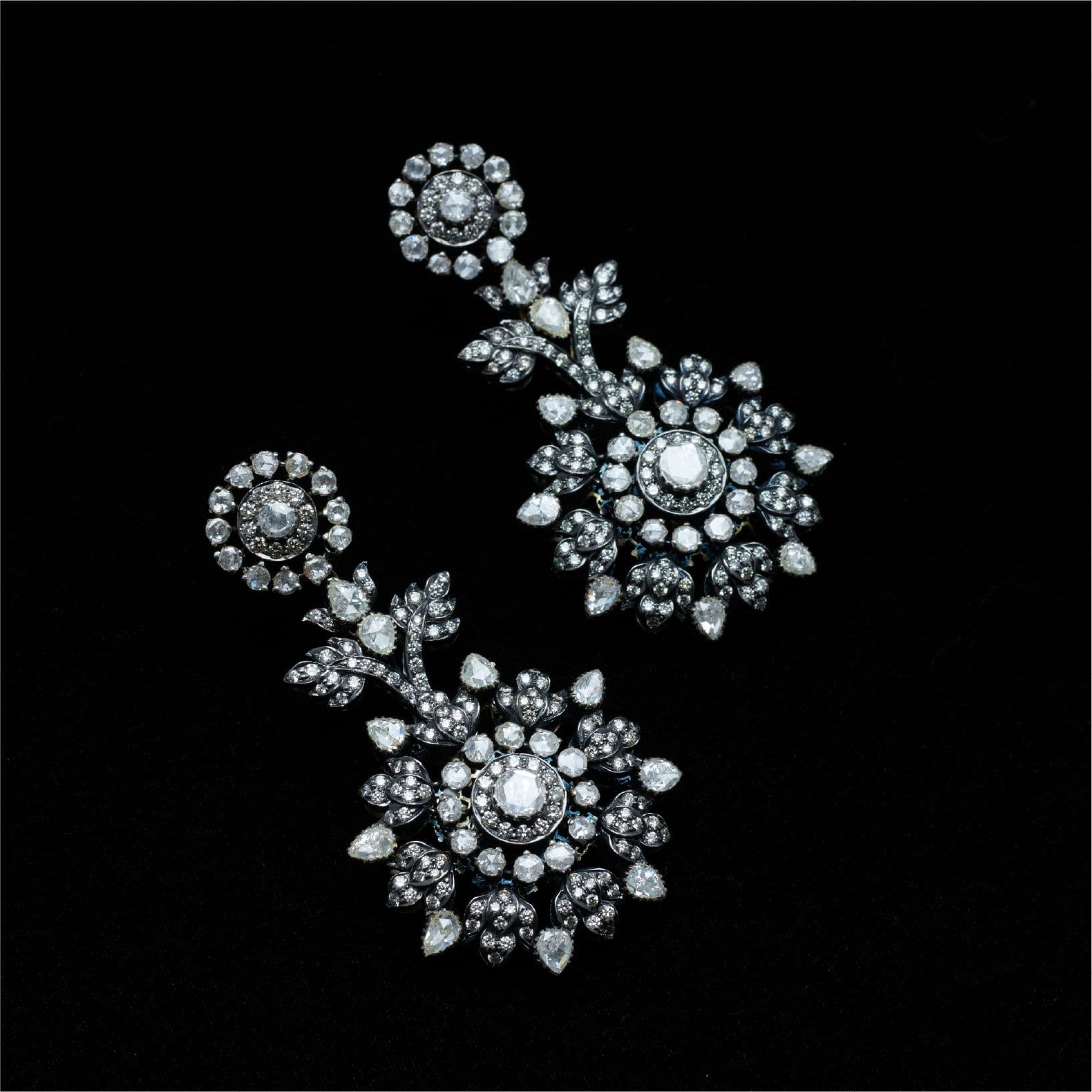 Diamond drop earrings on black