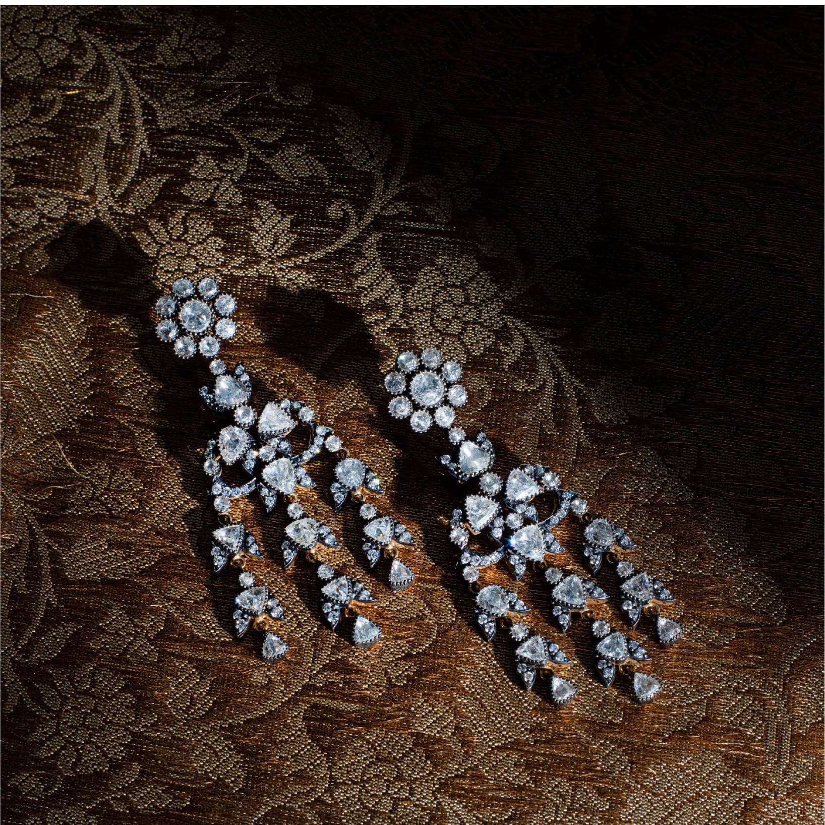Diamond tassel earrings on gold brocade