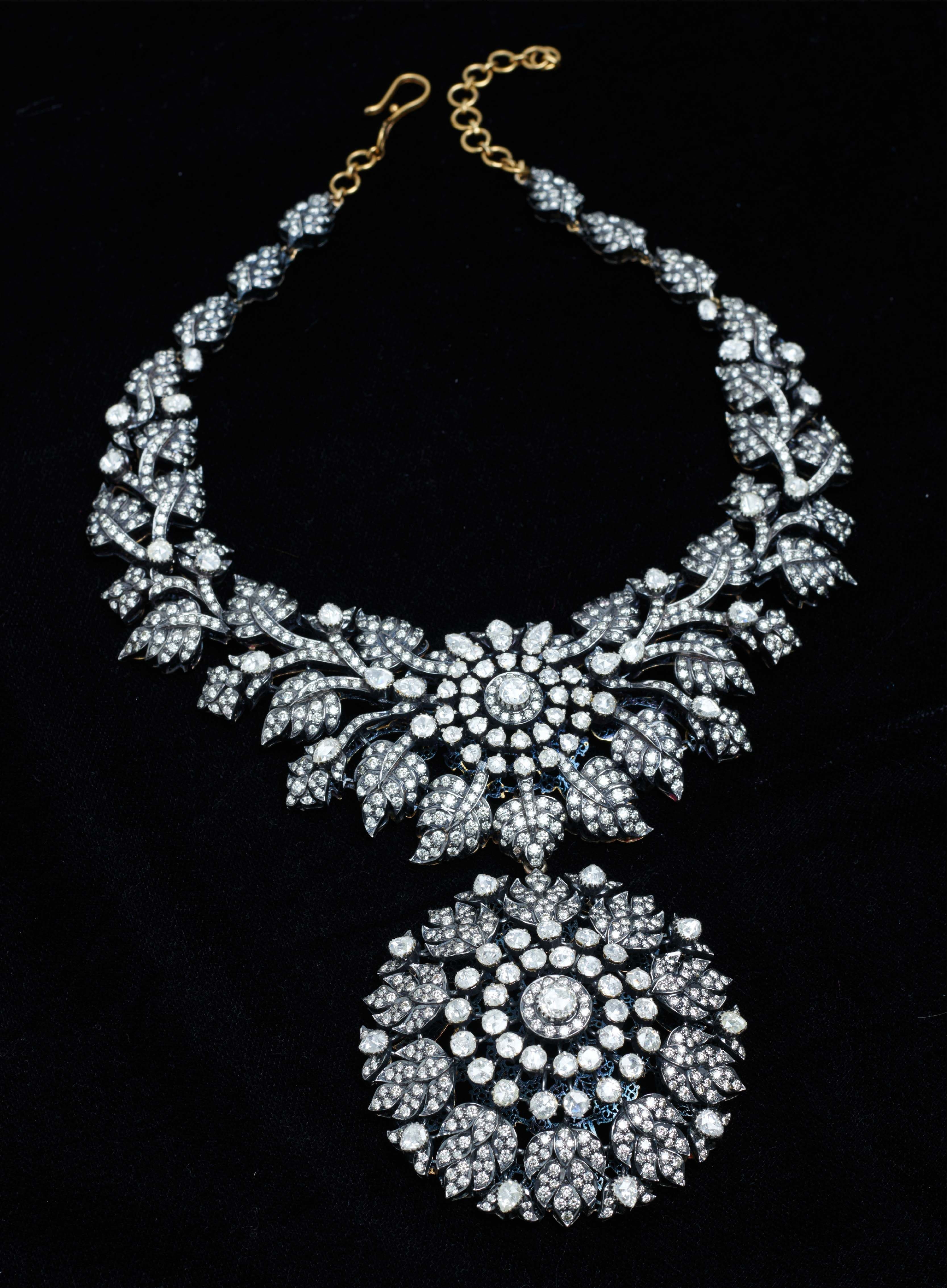 The signature diamond bow necklace with medallion pendant