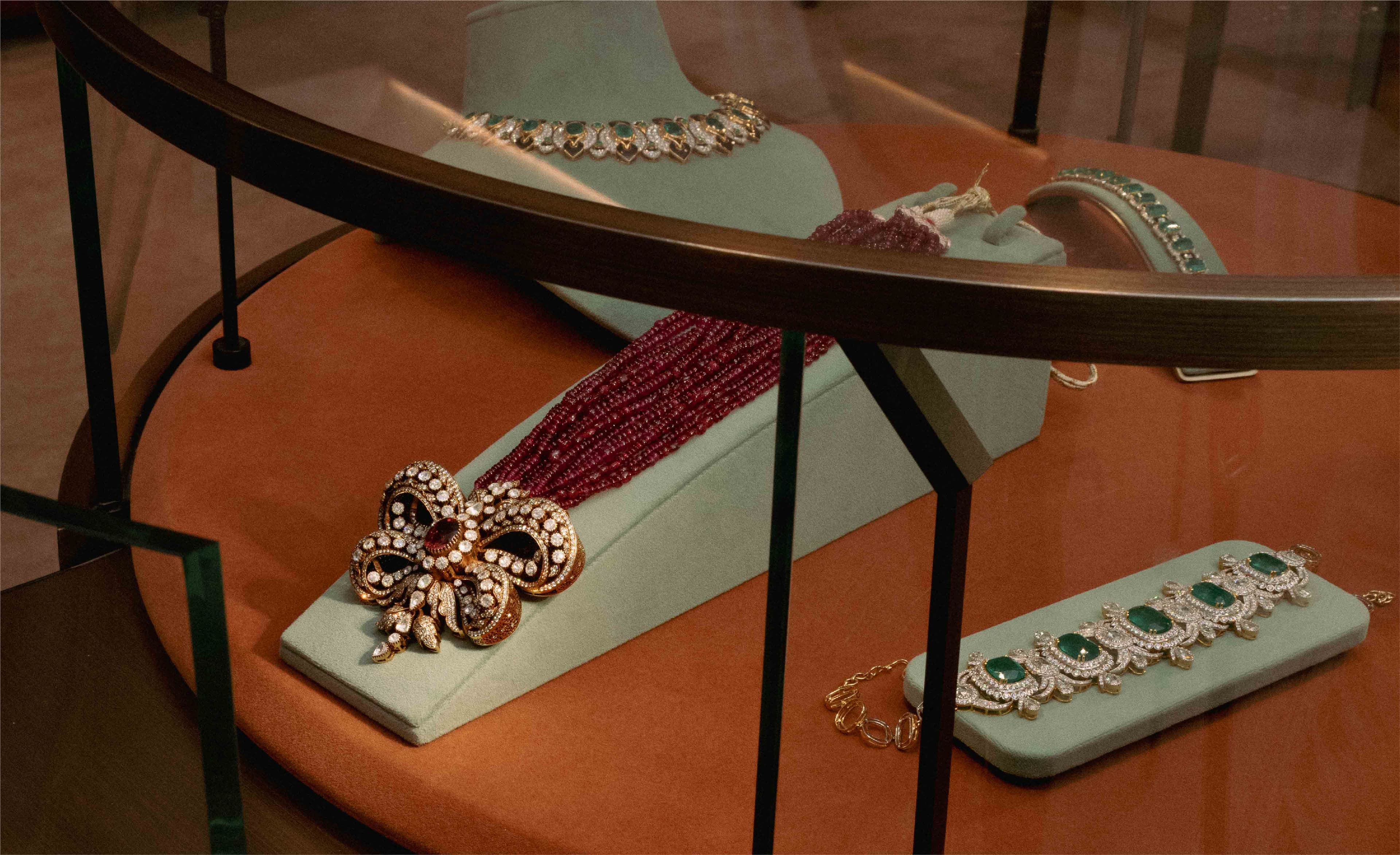 Art Deco — bow brooch and jewels arranged on a table