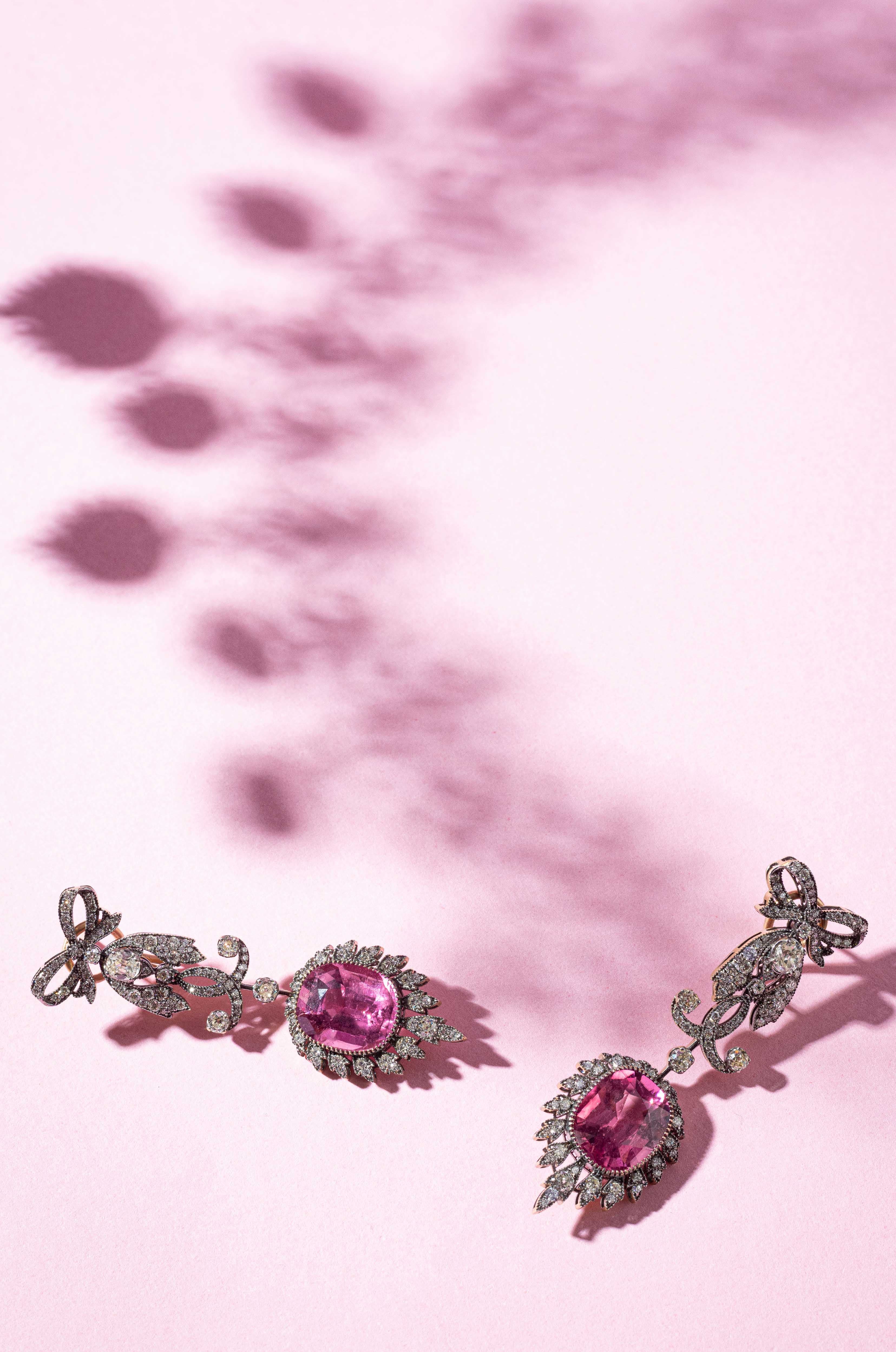 Bow earrings with pink stones and leaf shadows