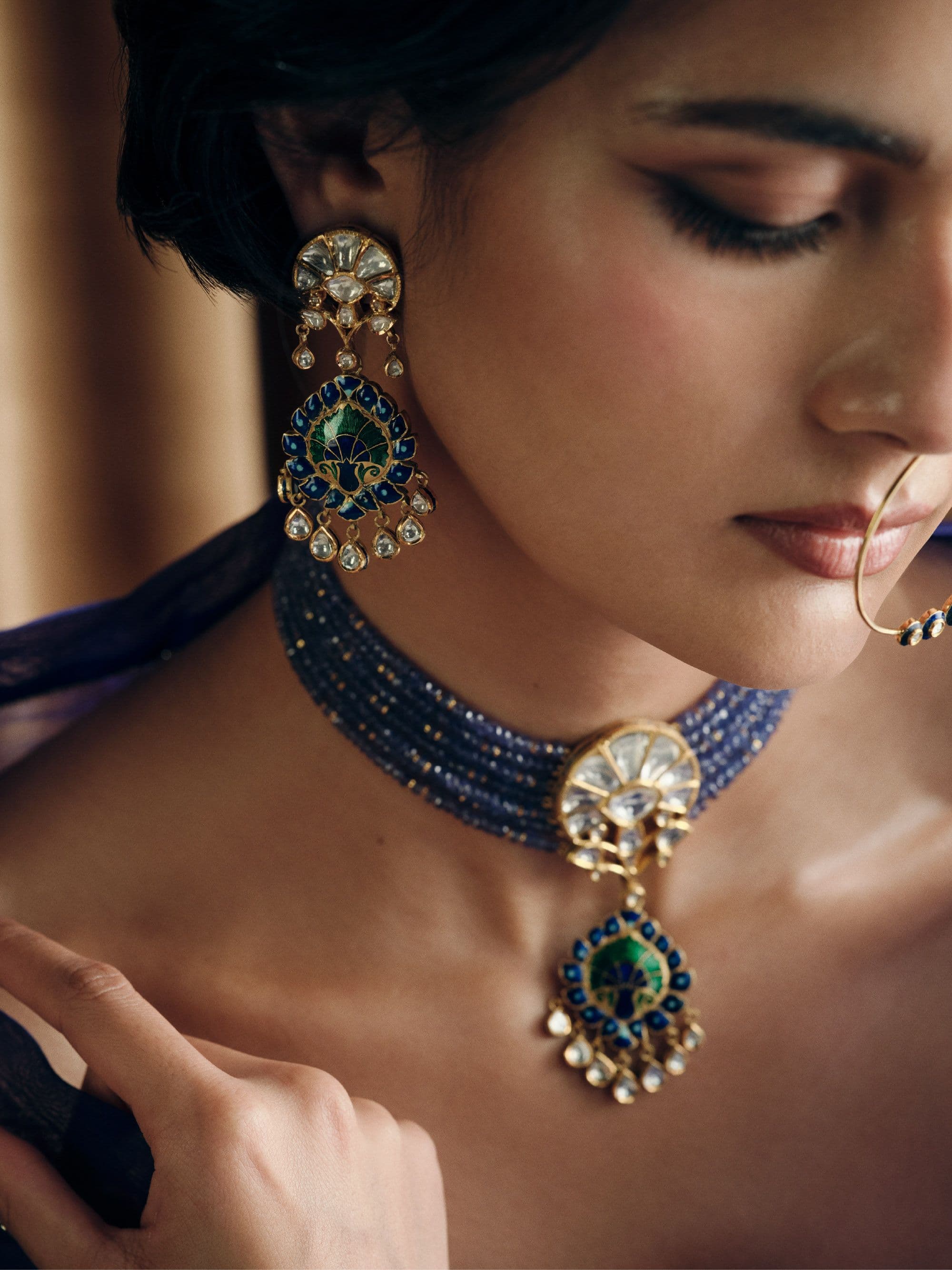 Peacock enamel earring in profile
