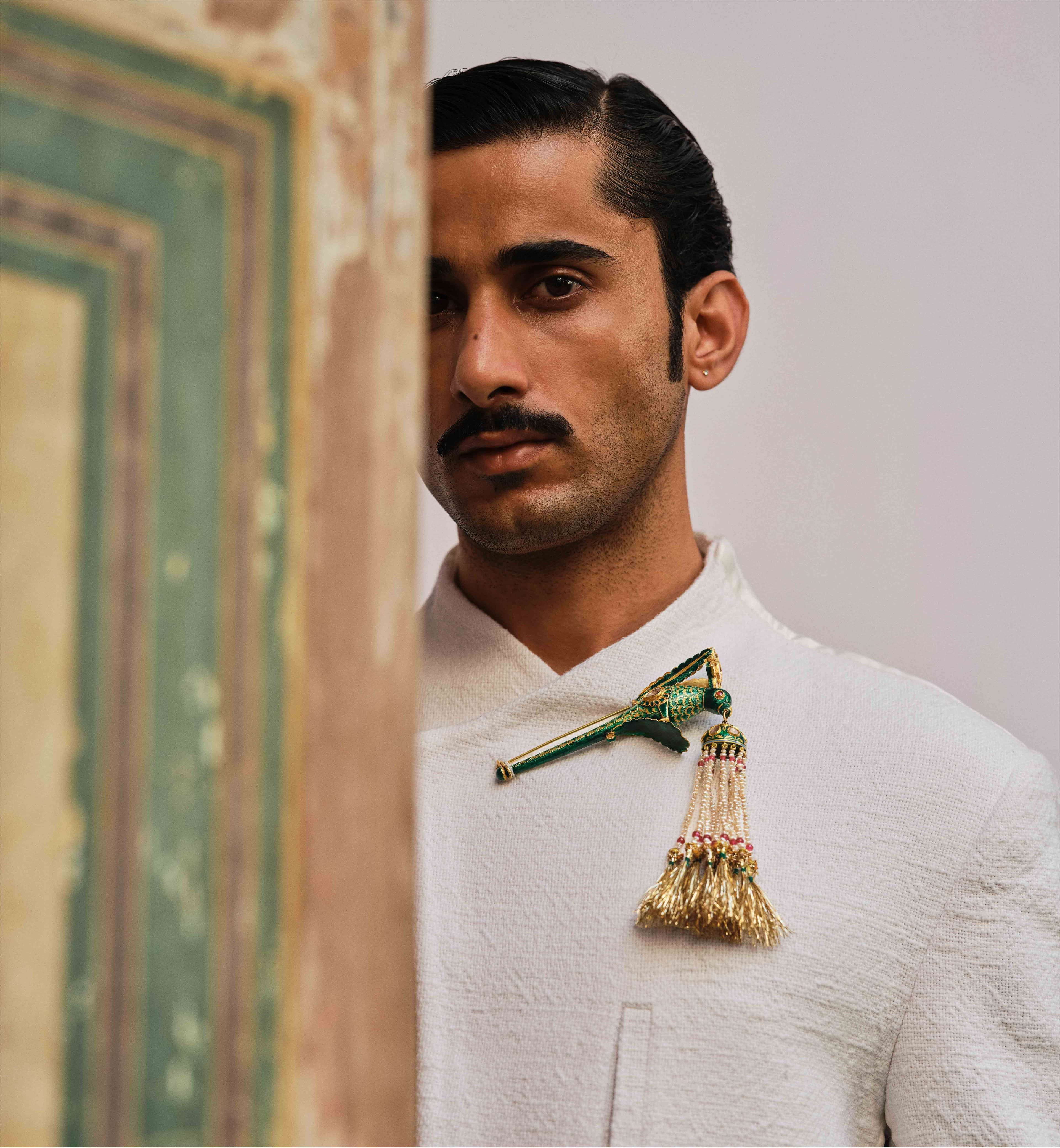 Mhaaro — solo portrait with emerald sarpech tassel