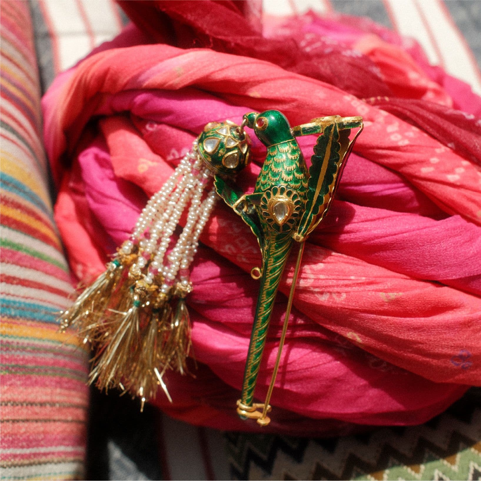 Parrot sarpech on pink fabric
