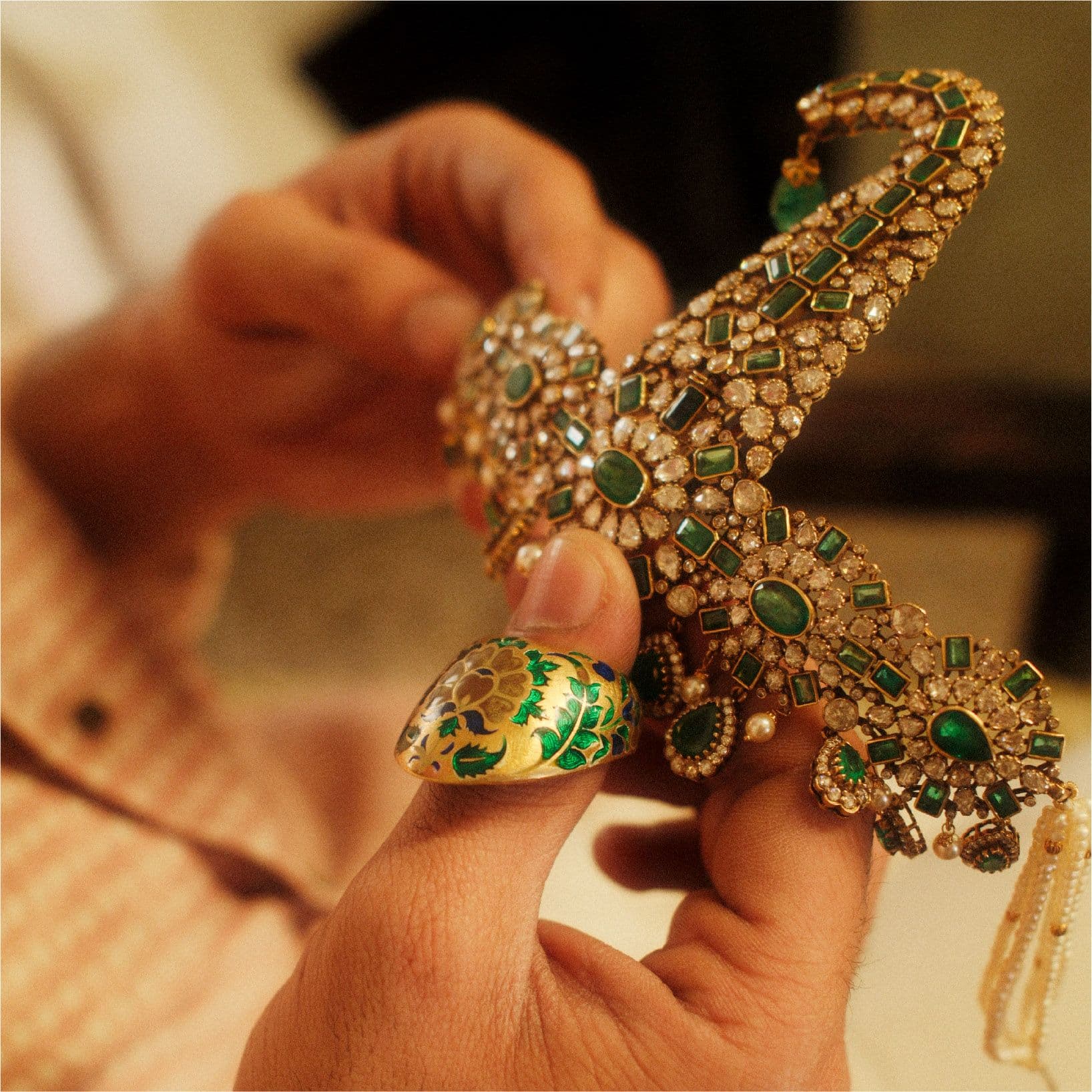 Emerald sarpech detail in hands