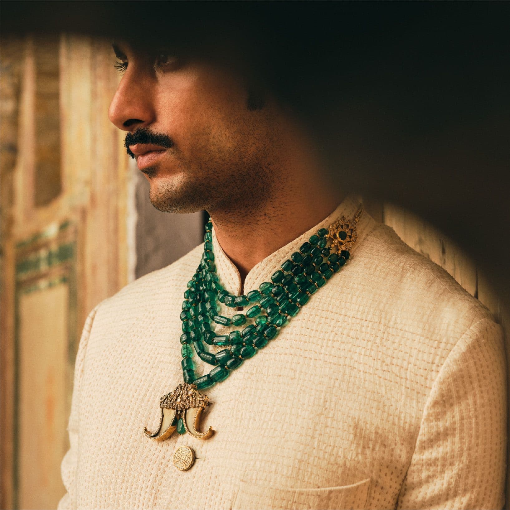 Profile portrait with emerald necklace