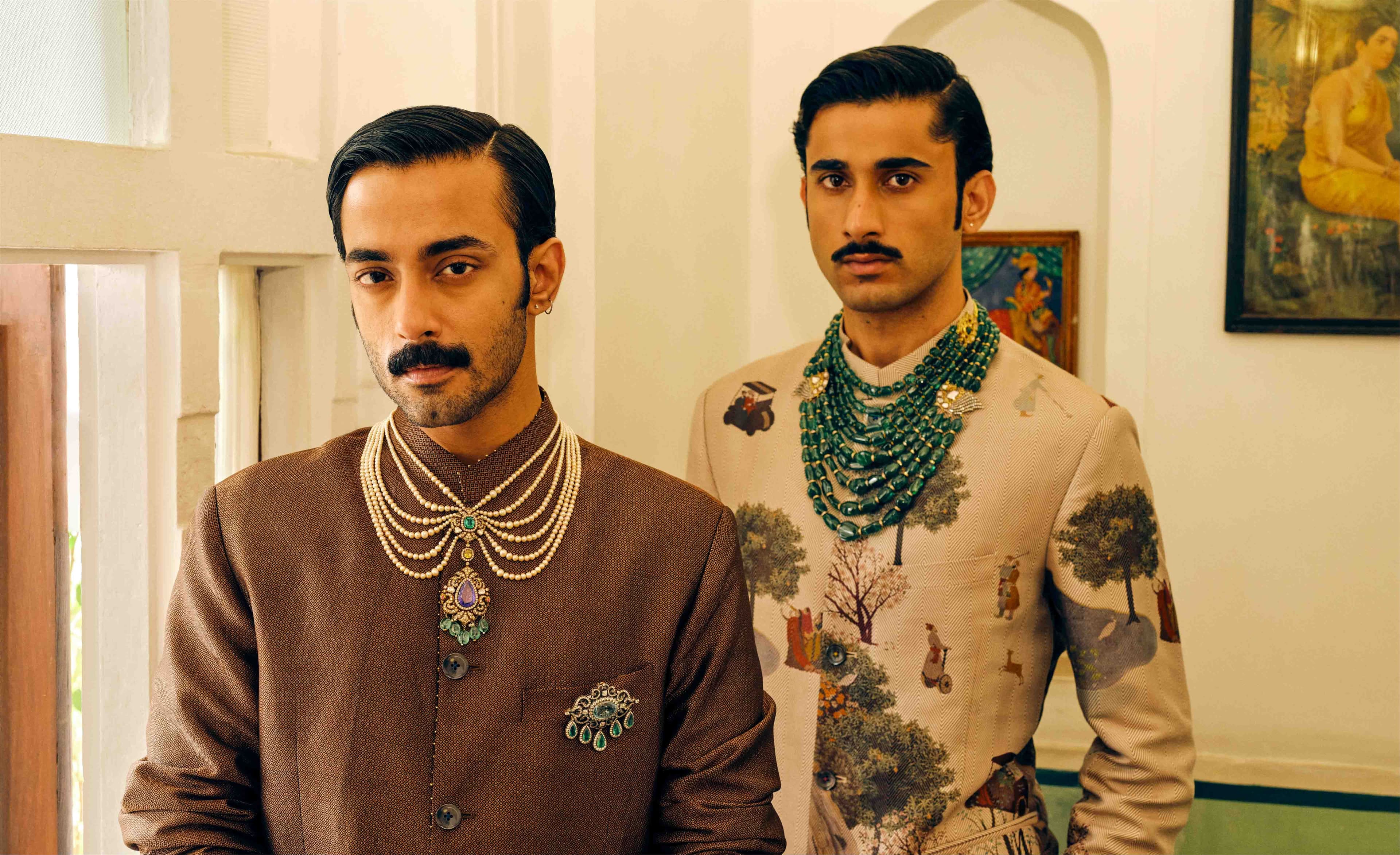 Mhaaro — two men in cream sherwanis with layered necklaces
